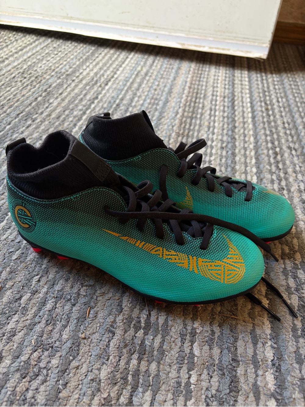 Nike Teal Soccer Cleats with Gold Swoosh